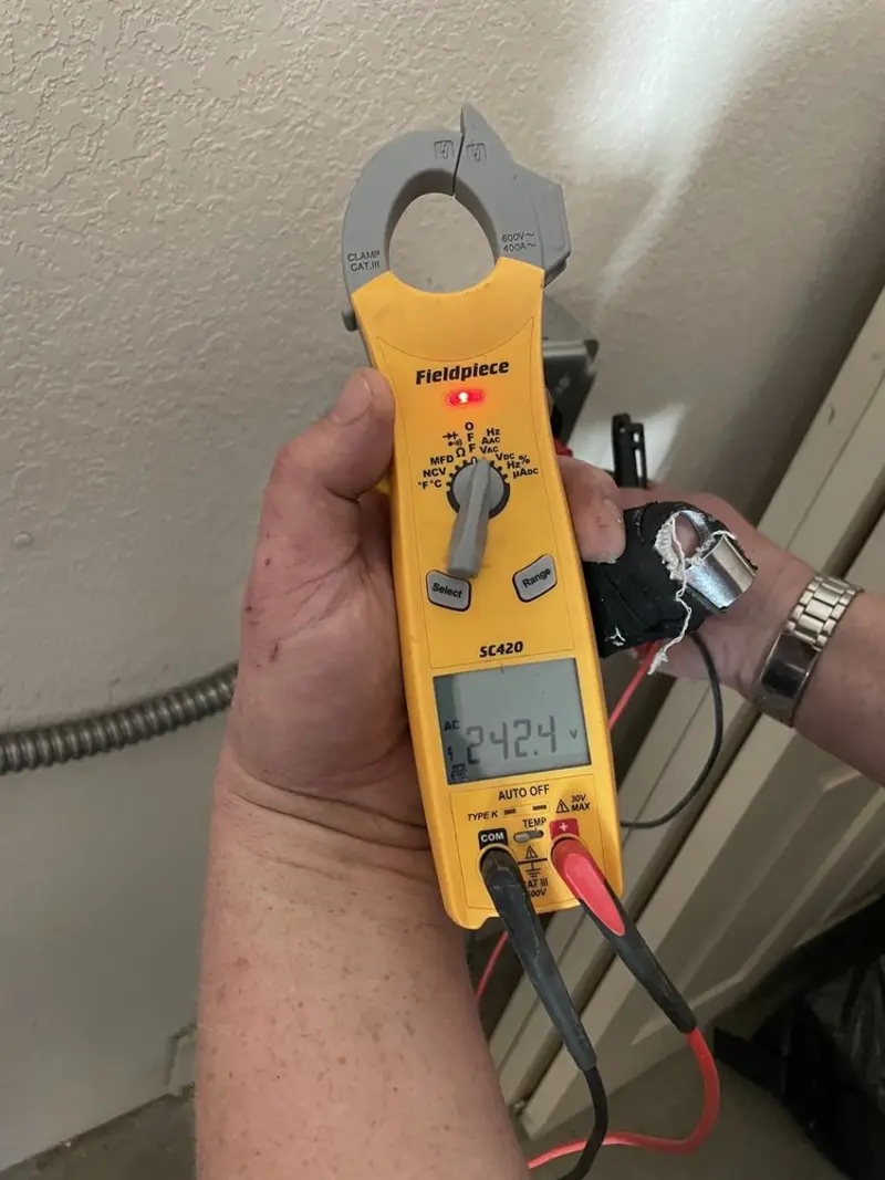 Voltage testing with clamp meter during Electrical Installation Services in Moultrie